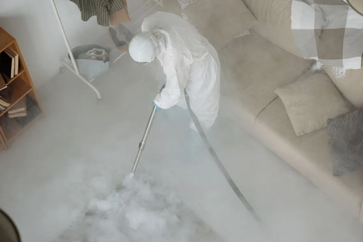 Biohazard cleanup technician in protective equipment, Orwell, OH
